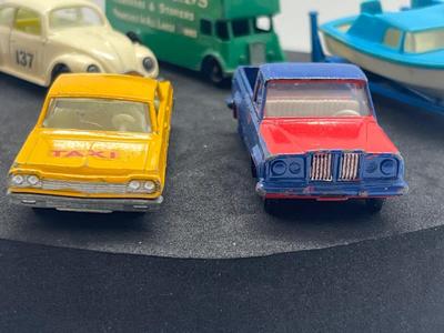 LOT 86: Vintage Lesney Matchbox - Chevrolet Impala Taxi, Volkswagon 1500 Saloon, Pickford Removal Van, Jeep Gladiator and Boat with Trailer