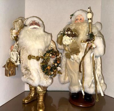 Two Santas Dressed in White and Gold