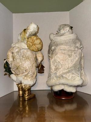 Two Santas Dressed in White and Gold