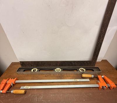 Sale Photo Thumbnail #36: Level and square have some rust, but are in solid, useable condition.  Jorgensen Clamps are 18" long and are in new condition.