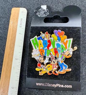 Sale Photo Thumbnail #453: Has the Fab 5: Mickey, Minnie, Goofy, Pluto and Donald on a colorful pin.  Great condition.