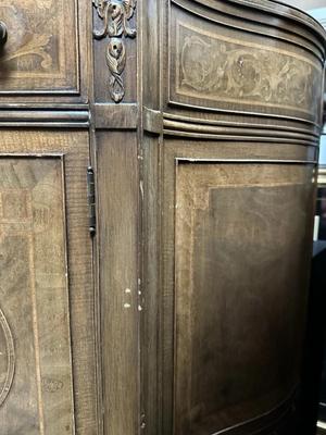 Sale Photo Thumbnail #388: Antique French Louis XV Demilune Commode Chest Cabinet Table w/Key

Condition Notes: In great antique condition with some scratch marks and one leg has a small crack on top and chip in wood. Slight crackling of the wood on the top of the cabinet where the