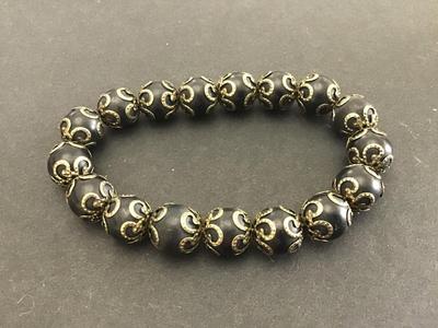 Black Stone Gold Accents Bracelet