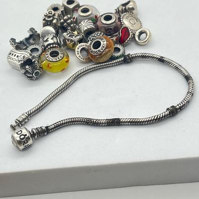 LOT 58: Sterling Silver 8" Pandora Bracelet with Beads/Charms/Hardware - 81 GTW