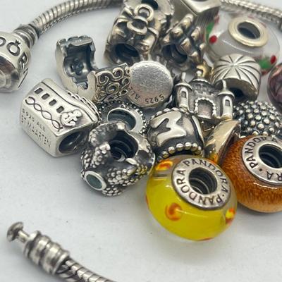 LOT 58: Sterling Silver 8" Pandora Bracelet with Beads/Charms/Hardware - 81 GTW