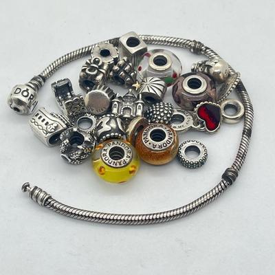 LOT 58: Sterling Silver 8" Pandora Bracelet with Beads/Charms/Hardware - 81 GTW