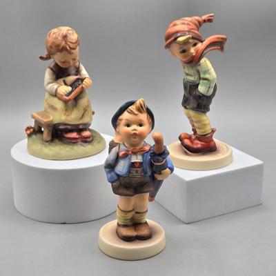 LOT 91: Hummel Figurines Home from the Market, Busy Student, and March Winds
