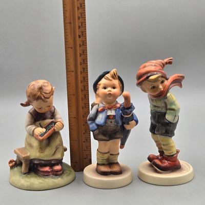 LOT 91: Hummel Figurines Home from the Market, Busy Student, and March Winds