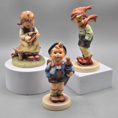 LOT 91: Hummel Figurines Home from the Market, Busy Student, and March Winds