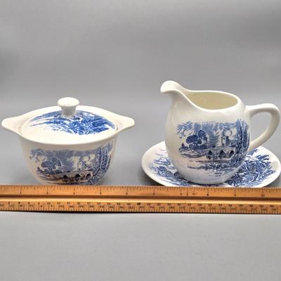 LOT 131: Enoch Wedgwood Tunstall Countryside Pieces Including 12 Cups, 17 Saucers, Creamer, and Sugar/ Storage Cases Included