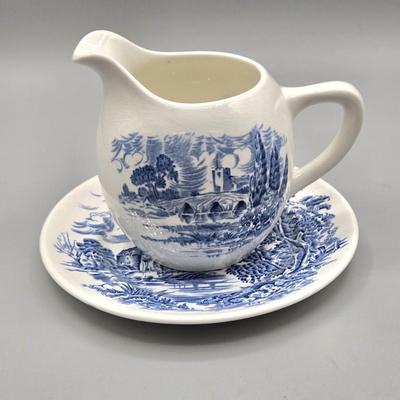 LOT 131: Enoch Wedgwood Tunstall Countryside Pieces Including 12 Cups, 17 Saucers, Creamer, and Sugar/ Storage Cases Included
