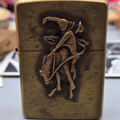 LOT 139: Primitive Wooden Box Filled with Treasures Such as Bucking Bronco and Cowboy Brass Zippo Lighter, Hixon Lumber Co. Tape Measure,...