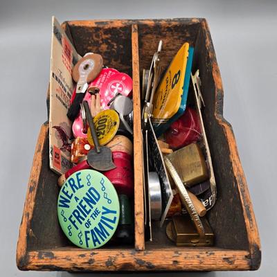 LOT 139: Primitive Wooden Box Filled with Treasures Such as Bucking Bronco and Cowboy Brass Zippo Lighter, Hixon Lumber Co. Tape Measure,...
