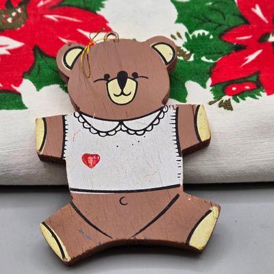 LOT 140: All Things Christmas, Including Glass Jar Filled with 1970s Wooden Christmas Ornaments, Vintage Santa Candle, 56x52 Tablecloth,...