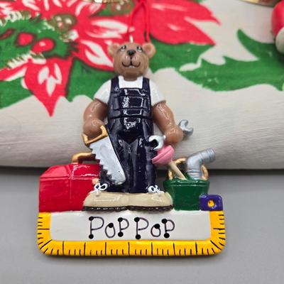 LOT 140: All Things Christmas, Including Glass Jar Filled with 1970s Wooden Christmas Ornaments, Vintage Santa Candle, 56x52 Tablecloth,...