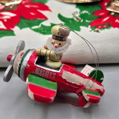 LOT 140: All Things Christmas, Including Glass Jar Filled with 1970s Wooden Christmas Ornaments, Vintage Santa Candle, 56x52 Tablecloth,...