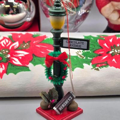 LOT 140: All Things Christmas, Including Glass Jar Filled with 1970s Wooden Christmas Ornaments, Vintage Santa Candle, 56x52 Tablecloth,...