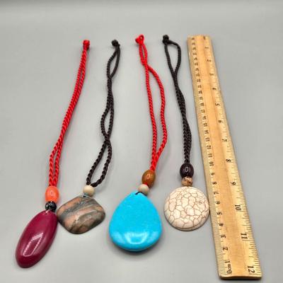 LOT 154J: Polished Stone Necklaces, Bangle Bracelets, and 2 Pairs of Pierced Earrings