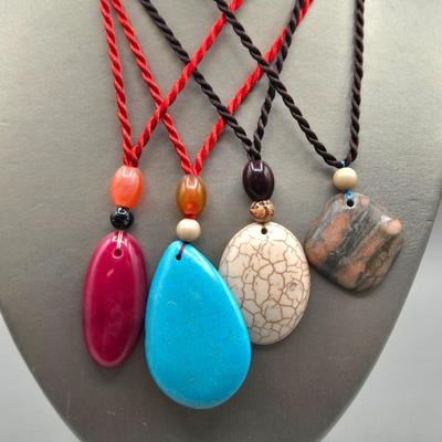 LOT 154J: Polished Stone Necklaces, Bangle Bracelets, and 2 Pairs of Pierced Earrings