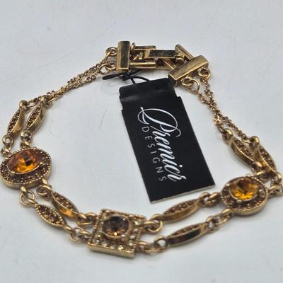 LOT 174J: Variety of Gold-tone Stretch and Clasp Bracelets