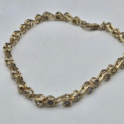 LOT 174J: Variety of Gold-tone Stretch and Clasp Bracelets