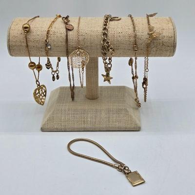 LOT 196J: Multiple Gold-tone Bracelets and Ankle Bracelets
