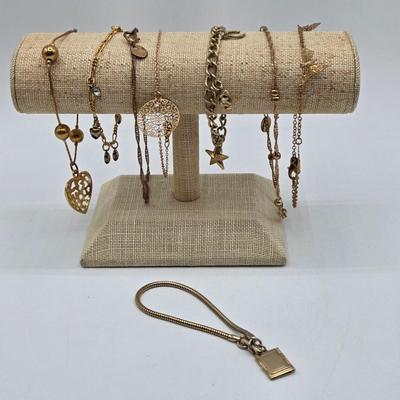 LOT 196J: Multiple Gold-tone Bracelets and Ankle Bracelets