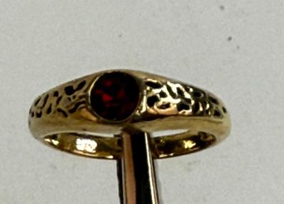 Sale Photo Thumbnail #15: Round red stone (imitation ruby?), ring has no markings. Size 5. Very Pretty.