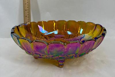 Sale Photo Thumbnail #598: Nice, heavy footed bowl. Iridescent amber color.  Scalloped top edge. Approx. 12" long at the widest part.