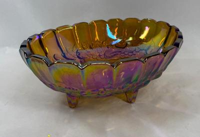 Sale Photo Thumbnail #597: Nice, heavy footed bowl. Iridescent amber color.  Scalloped top edge. Approx. 12" long at the widest part.