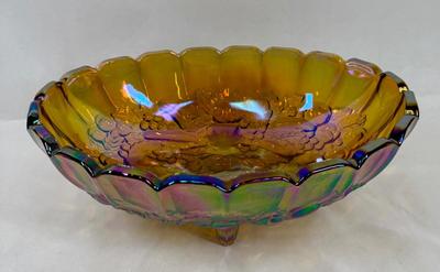 Sale Photo Thumbnail #595: Nice, heavy footed bowl. Iridescent amber color.  Scalloped top edge. Approx. 12" long at the widest part.