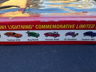 JOHNNY LIGHTNING COMMEMORATIVE LIMITED EDITION 8-CAR SET WITH REAL METAL CHROME PLATING