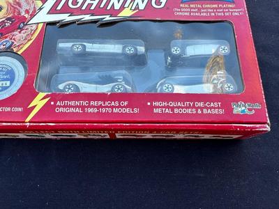 JOHNNY LIGHTNING COMMEMORATIVE LIMITED EDITION 4-CAR SET WITH REAL METAL CHROME PLATING