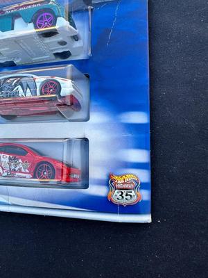 HOT WHEELS “YU-GI-OH” 3-CAR SET WITH LIMITED EDITION COLLECTOR GUIDE