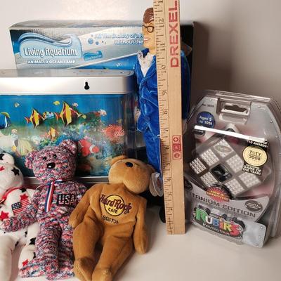 LOT 194: Living Aquarium in Box, Vintage Austin Powers Doll, Rubiks Cube & Beanie Babies