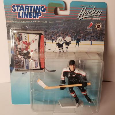 LOT 196: Philadelphia Sports Memorabilia with NFL Super Bowl Football, Mugs, Action Figures & More