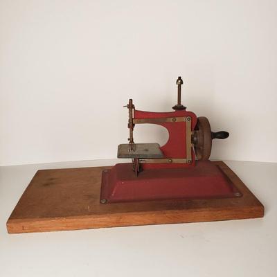 LOT 208: Vintage Miniature Toy Sewing Machine
