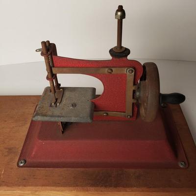 LOT 208: Vintage Miniature Toy Sewing Machine