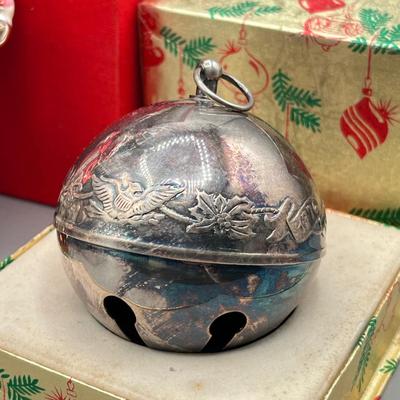 LOT 53: Vintage Holiday Decorations- featuring a Wallace Silversmiths annual silver-plated sleigh bell ornament