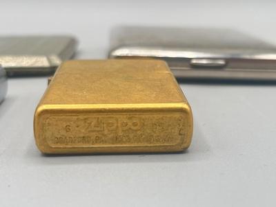 LOT 185: Vintage Cigarette Cases and Zippo Lighters