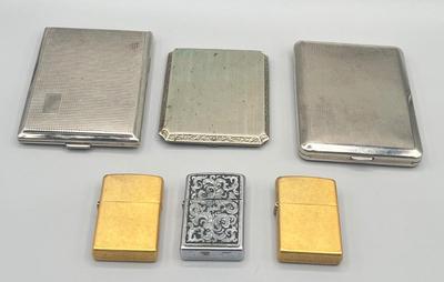 LOT 185: Vintage Cigarette Cases and Zippo Lighters