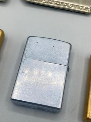 LOT 185: Vintage Cigarette Cases and Zippo Lighters