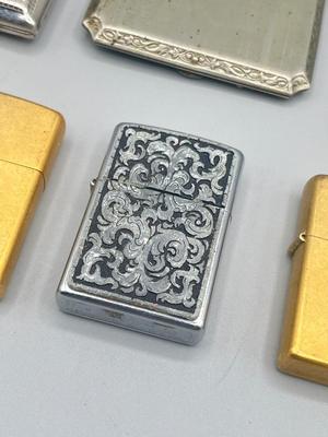 LOT 185: Vintage Cigarette Cases and Zippo Lighters