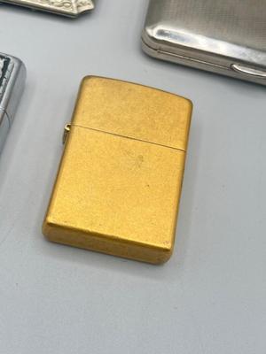 LOT 185: Vintage Cigarette Cases and Zippo Lighters