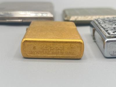 LOT 185: Vintage Cigarette Cases and Zippo Lighters