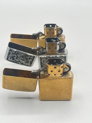 LOT 185: Vintage Cigarette Cases and Zippo Lighters