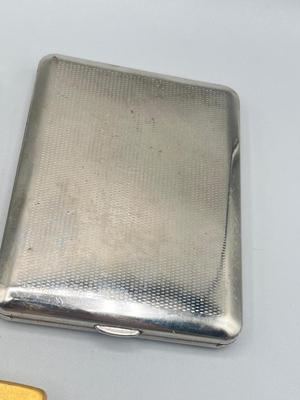 LOT 185: Vintage Cigarette Cases and Zippo Lighters