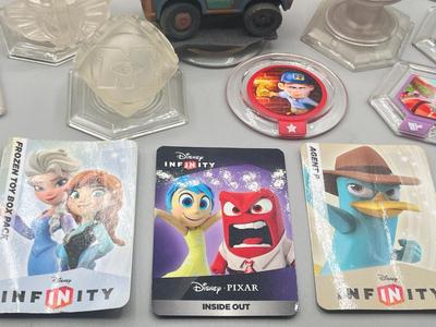 LOT 196: Disney Infinity Figures and Accessories - Toy Story, Incredibles, Frozen and More