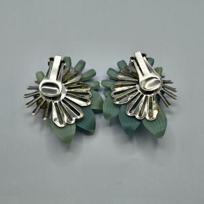 LOT 411: Multiple Pairs of Clip Earrings, Brooches, Silver-tone Chain with Winter Charms, and More