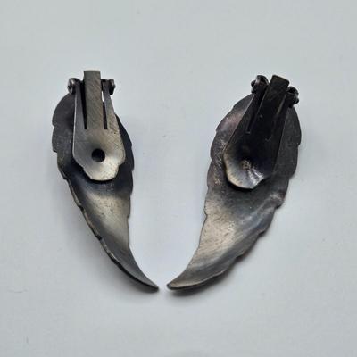 LOT 411: Multiple Pairs of Clip Earrings, Brooches, Silver-tone Chain with Winter Charms, and More